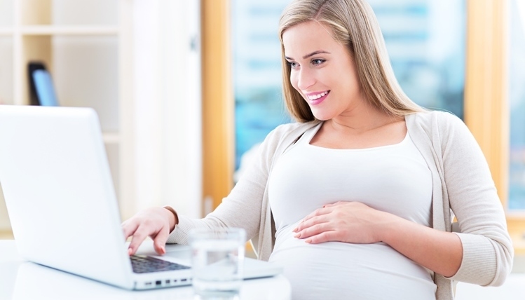 Pregnant woman with laptop