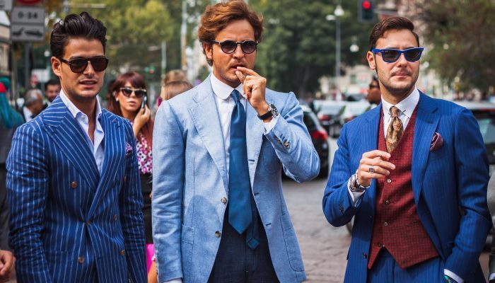 three businessmen standing in the street