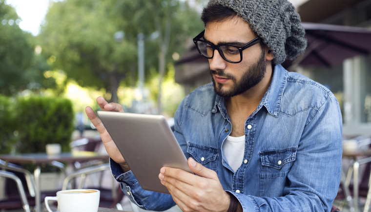 Man in cafe with tablet