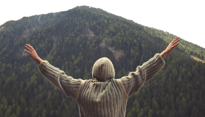 man looking at mountain