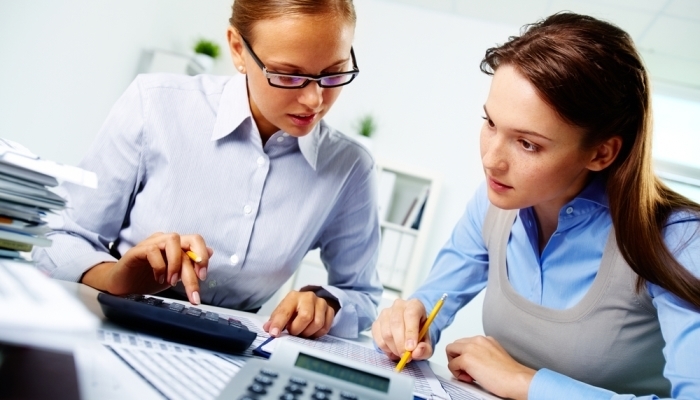 Two business women working together