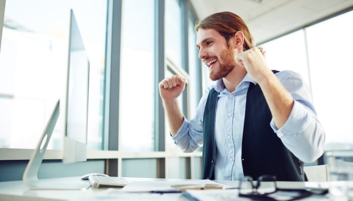 businessman looking at computer monitor in office