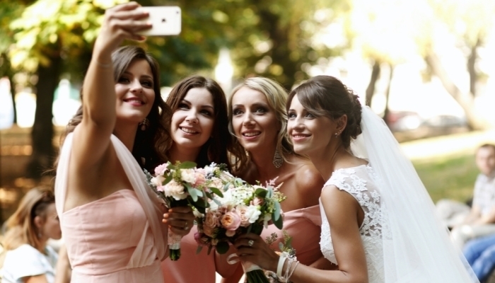 bridesmaid taking selfie