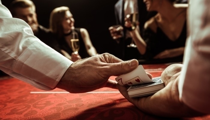 casino dealer shuffling cards