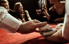 casino dealer shuffling cards