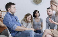 Substance abuse counsellor conducting group therapy session