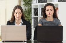 Two annoyed female colleagues