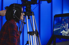Female TV producer working in studio