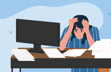 Illustration of a sad woman with her hands placed over her head while sitting at a desk